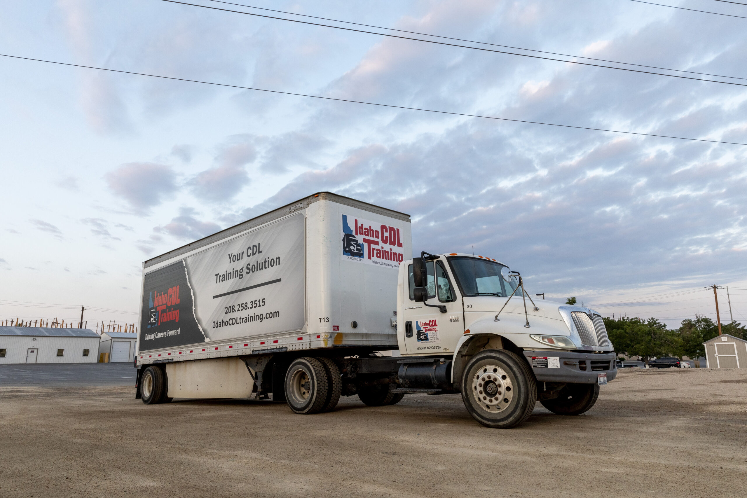 Idaho CDL Training Truck in dirt lot at NLC Idaho Campus